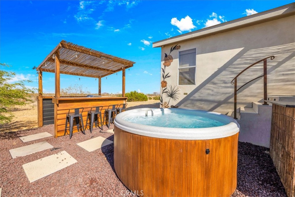 60707 Sonora Road Joshua Tree, CA 92252 - Photo 6 of 48 a roof deck with table and chairs