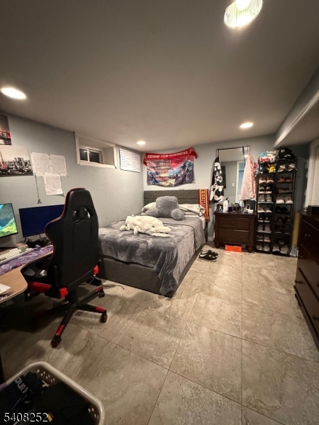 71 Wingra Avenue Rutherford, NJ 07070 - Photo 13 of 20 a bedroom with furniture and a gym equipment