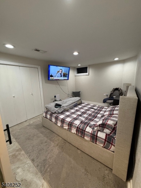 71 Wingra Avenue Rutherford, NJ 07070 - Photo 14 of 20 a bedroom with a bed and a view of bathroom