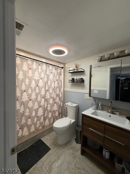 71 Wingra Avenue Rutherford, NJ 07070 - Photo 19 of 20 a bathroom with a sink toilet and shower