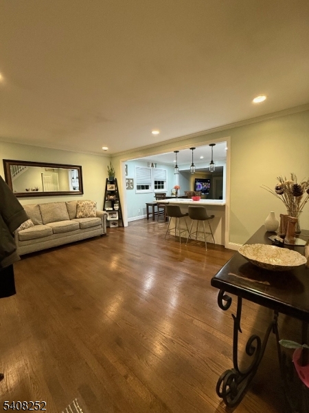 71 Wingra Avenue Rutherford, NJ 07070 - Photo 2 of 20 a living room with furniture a table and kitchen view