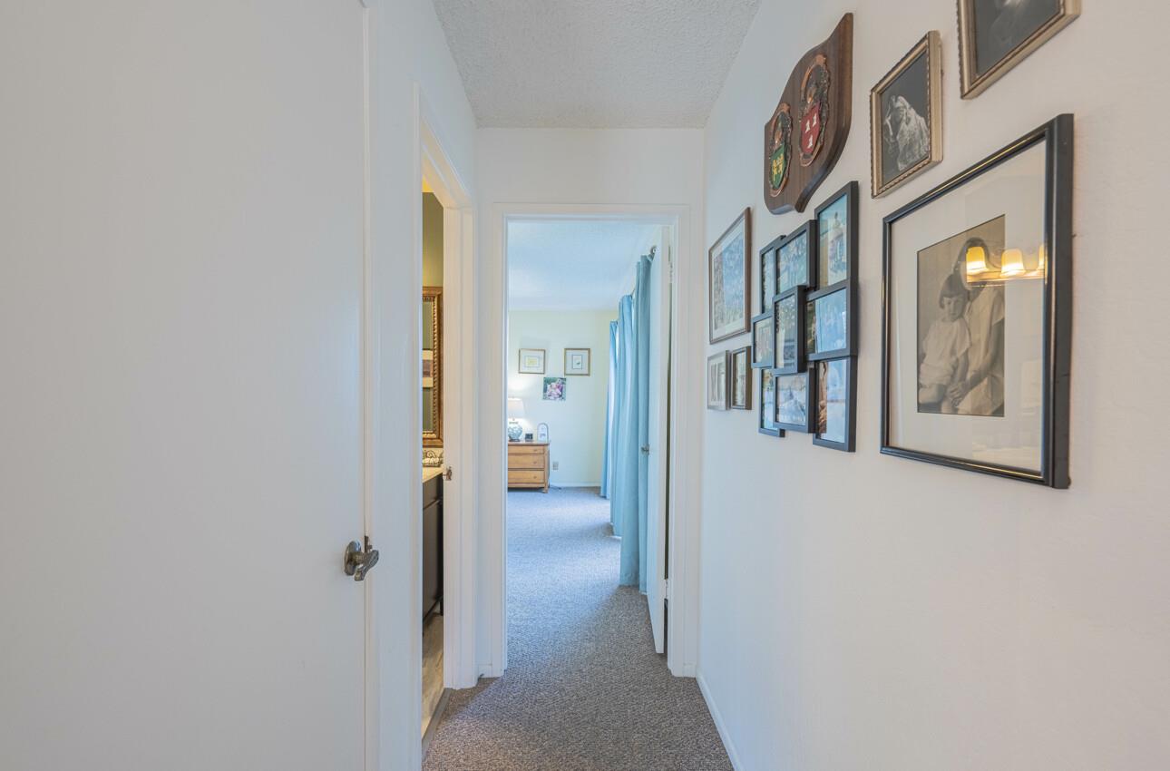 408 Kipling Street Salinas, CA 93901 - Photo 18 of 33 a view of a hallway with wooden floor and a bathroom