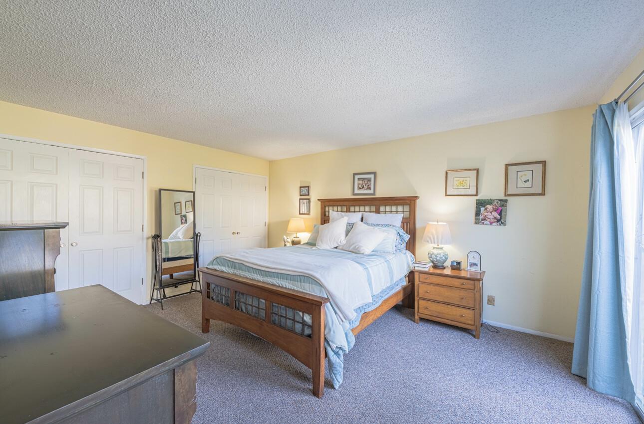 408 Kipling Street Salinas, CA 93901 - Photo 19 of 33 a bedroom with a bed and lamp