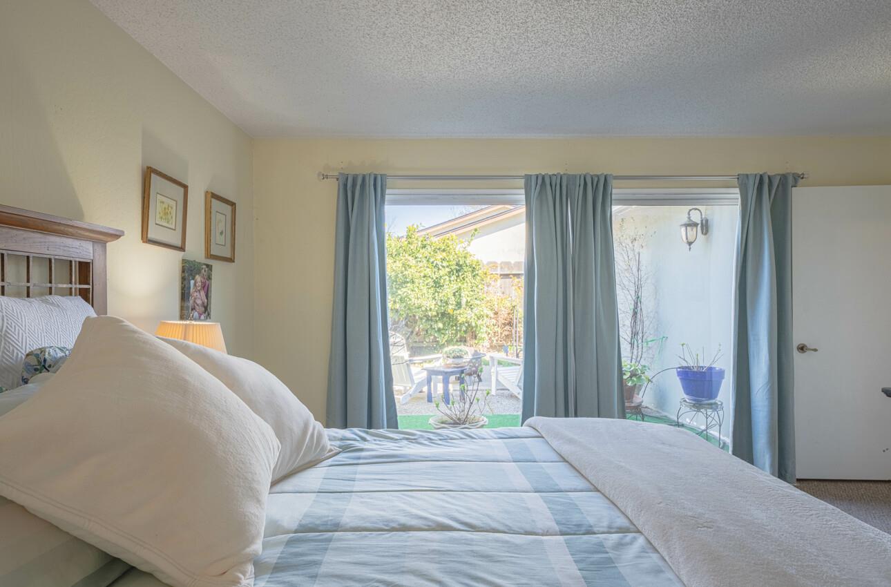 408 Kipling Street Salinas, CA 93901 - Photo 21 of 33 a bedroom with a bed and a window