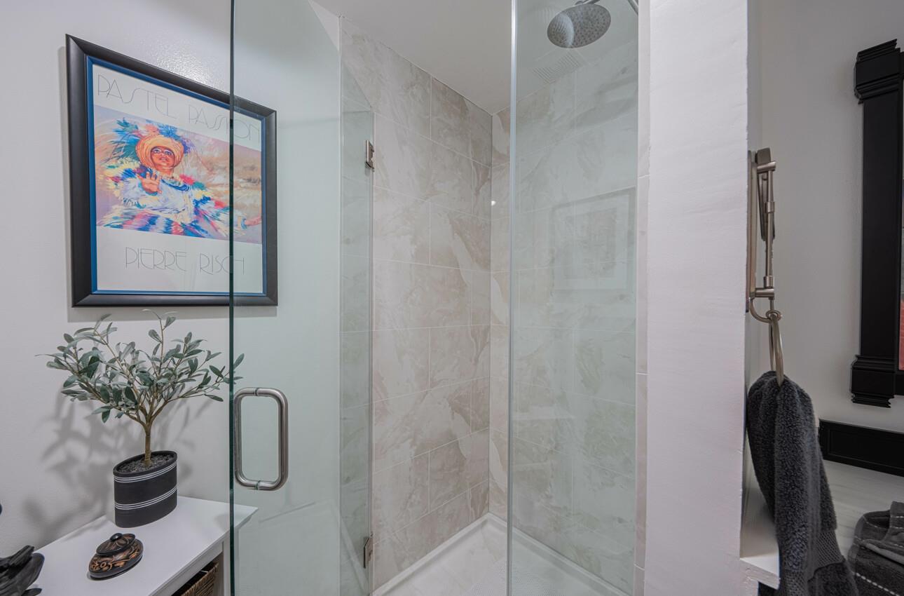 408 Kipling Street Salinas, CA 93901 - Photo 25 of 33 a bathroom with a painting on the wall and a potted plant