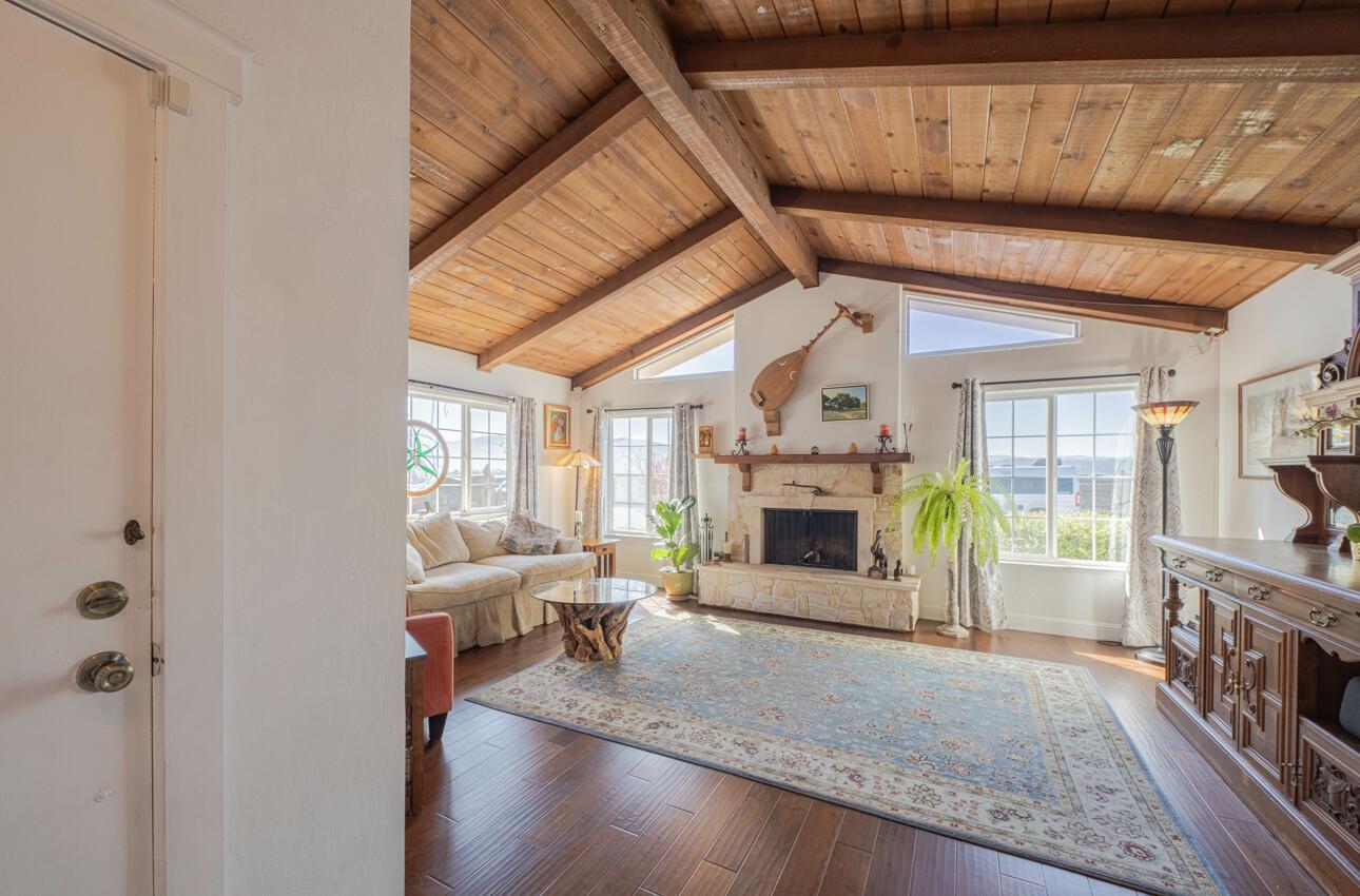 408 Kipling Street Salinas, CA 93901 - Photo 6 of 33 a living room with furniture a fireplace and a flat screen tv