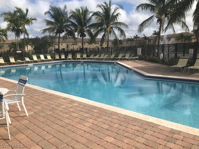 4063 Cherrybrook Loop Fort Myers, FL 33966 - Photo 14 of 15 a view of a swimming pool with a table and chairs