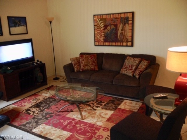 4063 Cherrybrook Loop Fort Myers, FL 33966 - Photo 5 of 15 a living room with furniture and a flat screen tv