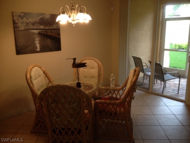 4063 Cherrybrook Loop Fort Myers, FL 33966 - Photo 6 of 15 a view of a dining room with furniture and chandelier