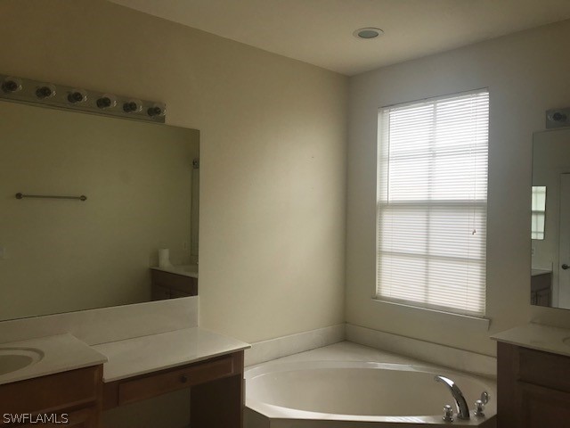 4063 Cherrybrook Loop Fort Myers, FL 33966 - Photo 9 of 15 a bathroom with a bathtub and window