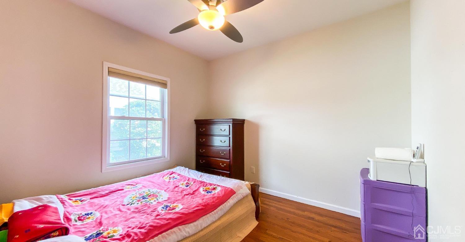 21 Hillsdale Road Edison, NJ 08820 - Photo 13 of 24 a bedroom with a bed and a window