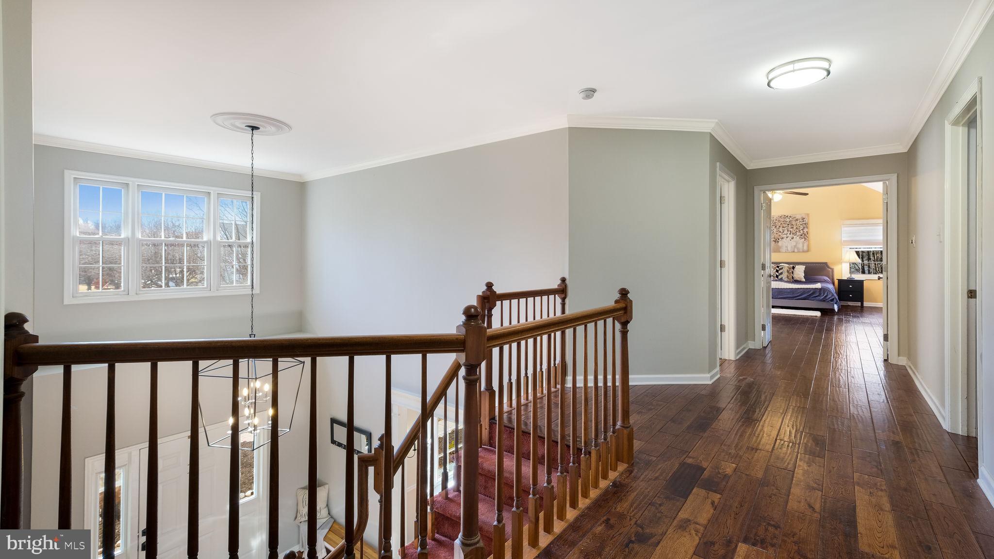 4 Bittersweet Drive Doylestown, PA 18901 - Photo 13 of 32 a view of a hallway with wooden floor and windows