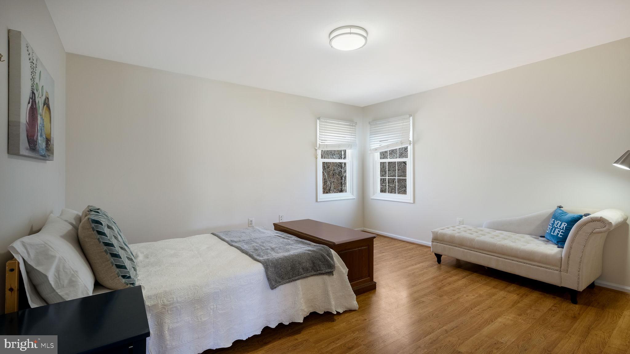 4 Bittersweet Drive Doylestown, PA 18901 - Photo 21 of 32 a spacious bedroom with a bed and wooden floor