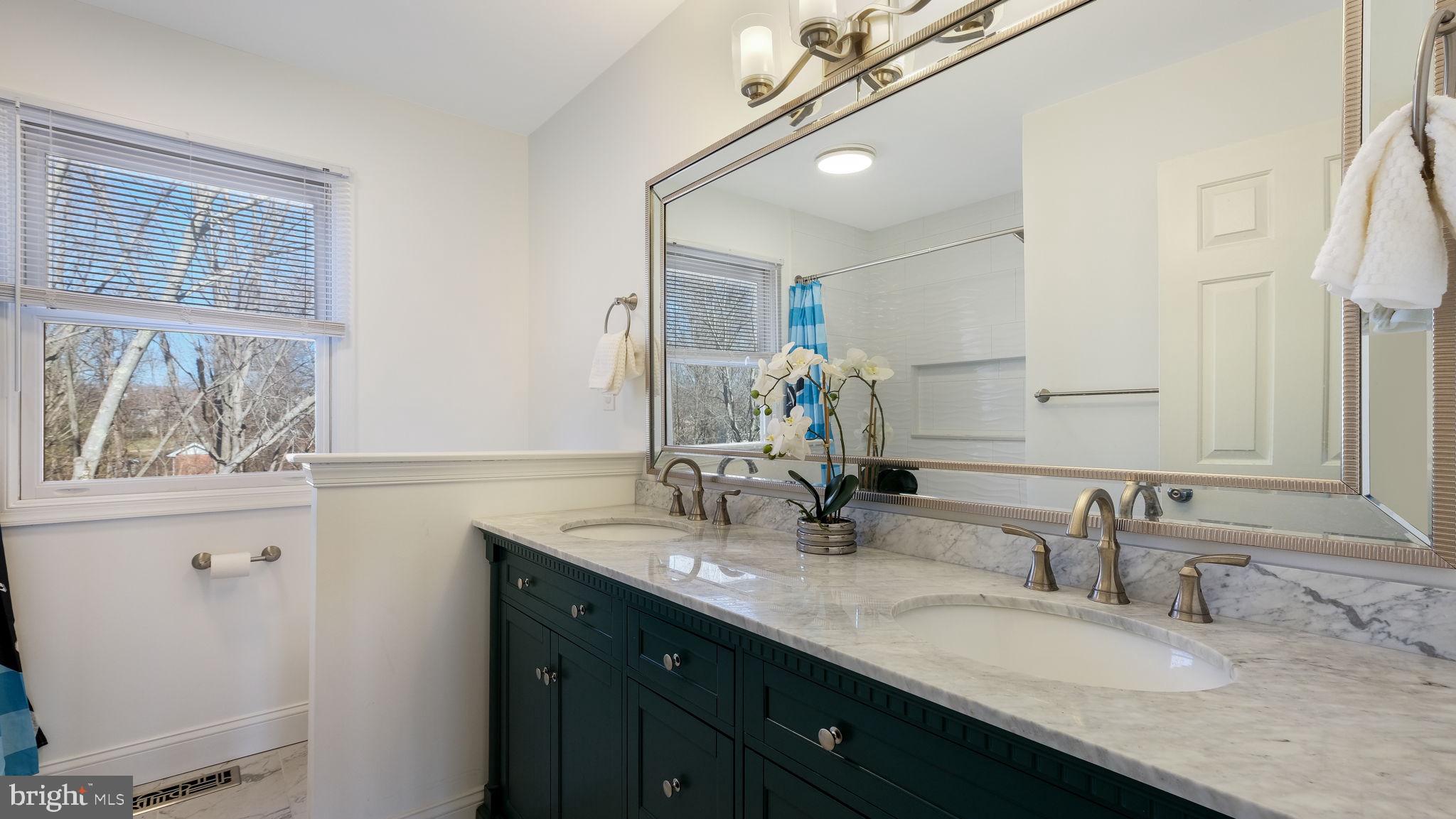 4 Bittersweet Drive Doylestown, PA 18901 - Photo 22 of 32 a bathroom with a granite countertop sink a large mirror and a window
