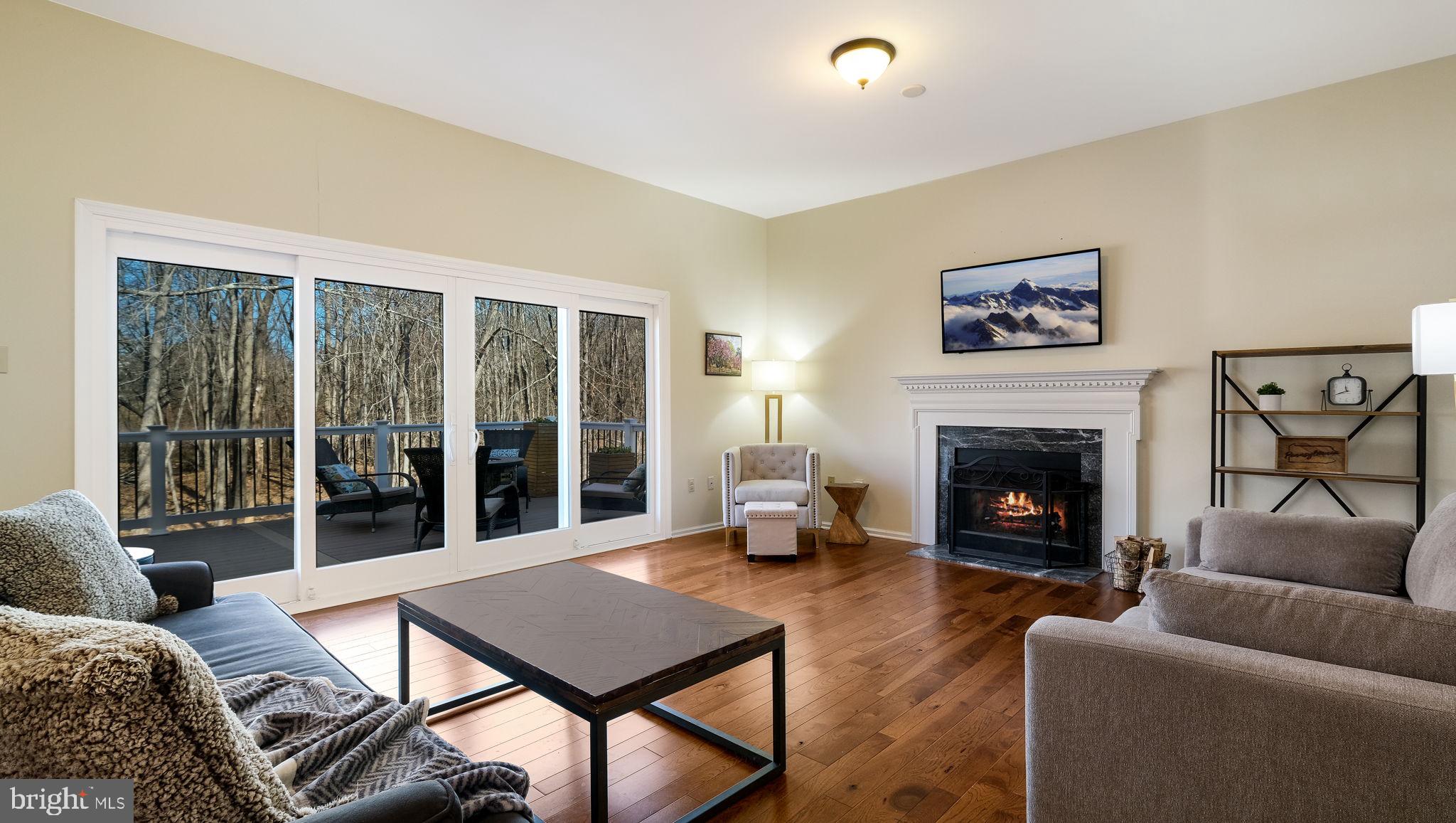 4 Bittersweet Drive Doylestown, PA 18901 - Photo 4 of 32 a living room with furniture large window and a fireplace