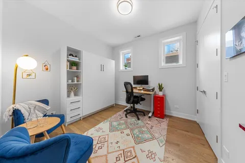 a view of a livingroom with workspace and a couch