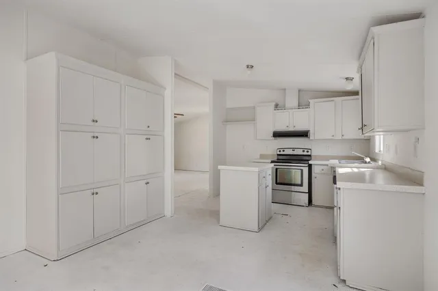 a kitchen with cabinets and appliances