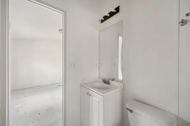 a bathroom with a sink and mirror