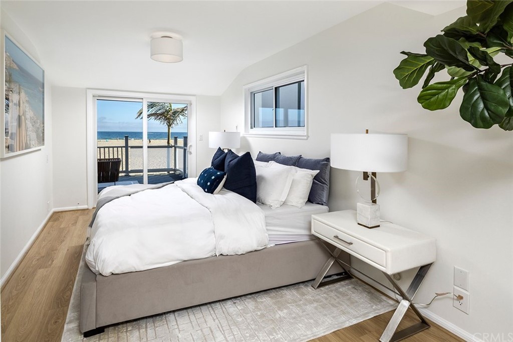 1708 West Oceanfront Newport Beach, CA 92663 - Photo 16 of 43 a bedroom with a bed and window