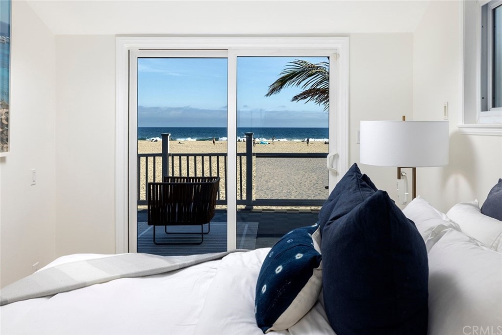 1708 West Oceanfront Newport Beach, CA 92663 - Photo 17 of 43 a bedroom with a bed and a painting on the wall