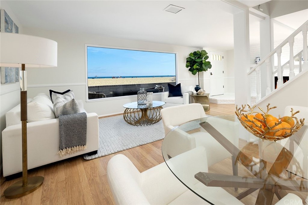 1708 West Oceanfront Newport Beach, CA 92663 - Photo 2 of 43 a living room with furniture and wooden floor