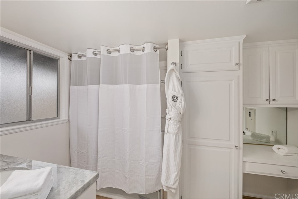 1708 West Oceanfront Newport Beach, CA 92663 - Photo 21 of 43 a bathroom with a sink and a mirror