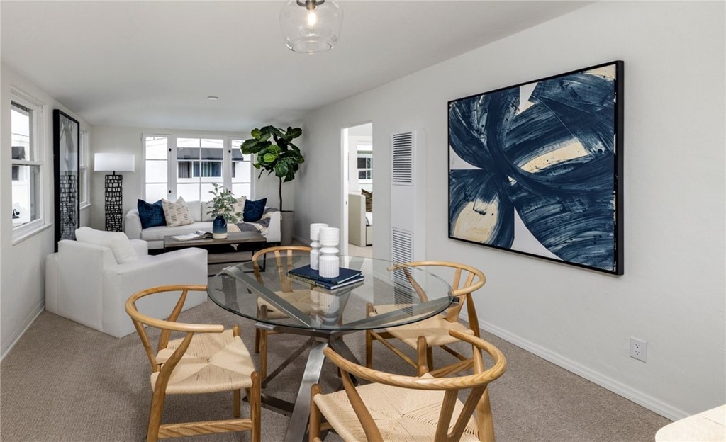 1708 West Oceanfront Newport Beach, CA 92663 - Photo 29 of 43 a living room with furniture a rug and wall paintings
