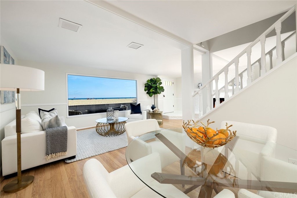 1708 West Oceanfront Newport Beach, CA 92663 - Photo 4 of 43 a living room with furniture and a fireplace