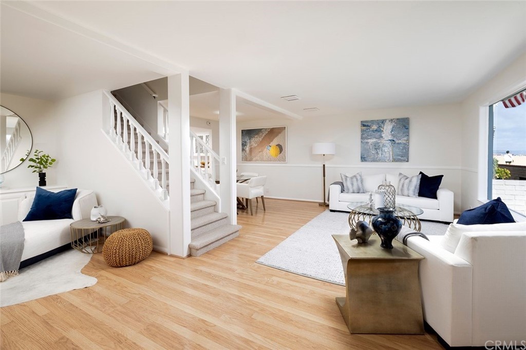 1708 West Oceanfront Newport Beach, CA 92663 - Photo 6 of 43 a living room with furniture and a table