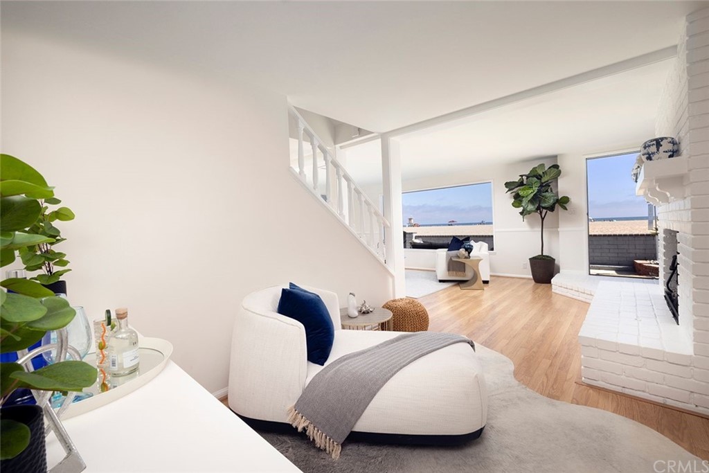 1708 West Oceanfront Newport Beach, CA 92663 - Photo 7 of 43 a living room with furniture and a fireplace
