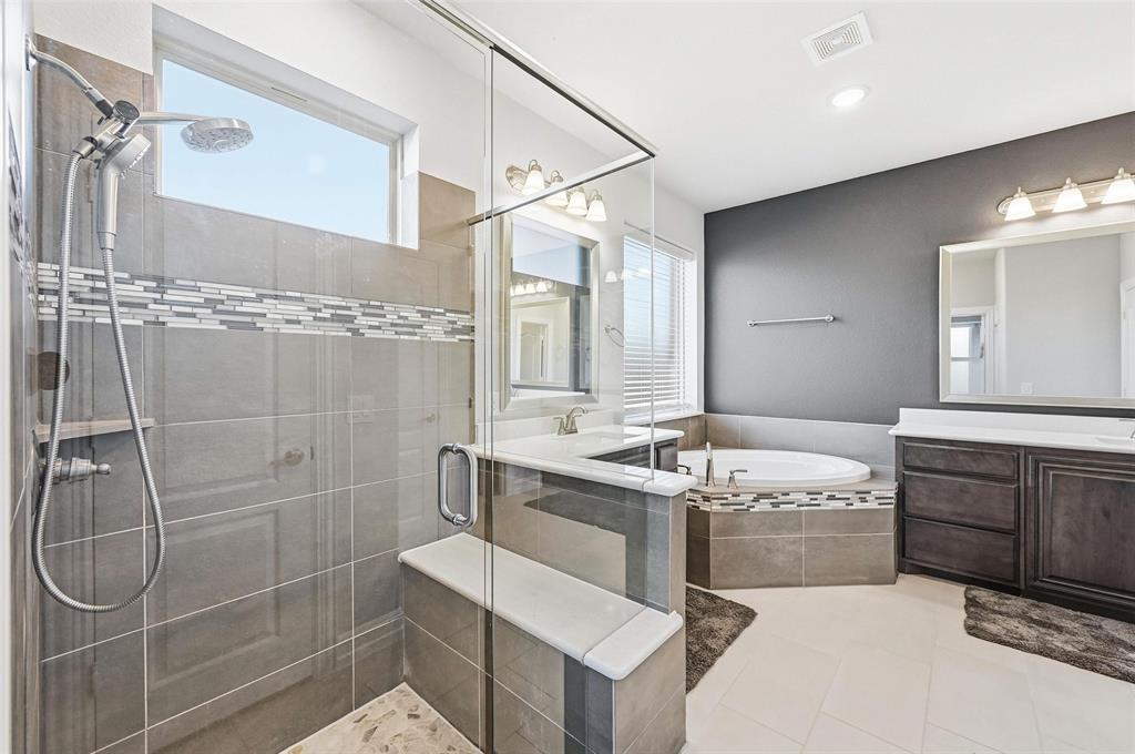 609 Dusty Glen Trail Midlothian, TX 76065 - Photo 19 of 40 a bathroom with a granite countertop sink a toilet and shower