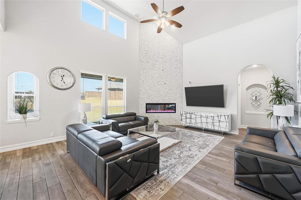 609 Dusty Glen Trail Midlothian, TX 76065 - Photo 2 of 40 a living room with furniture and a flat screen tv