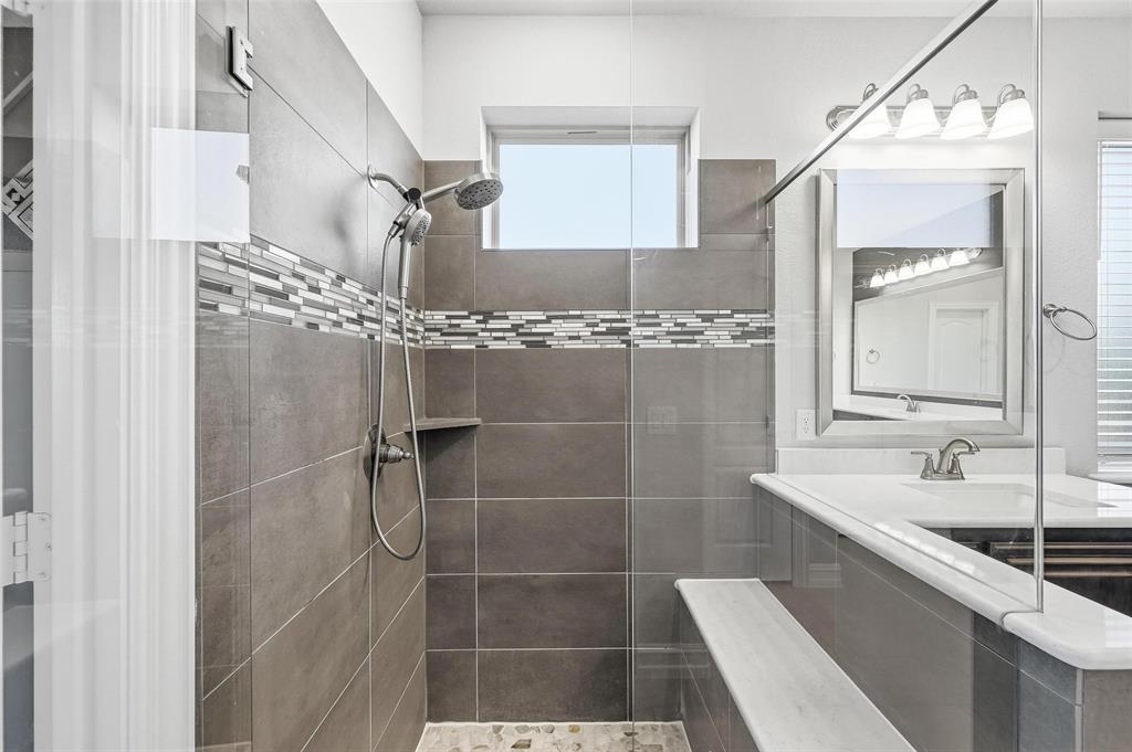 609 Dusty Glen Trail Midlothian, TX 76065 - Photo 21 of 40 a bathroom with a double vanity sink mirror and shower