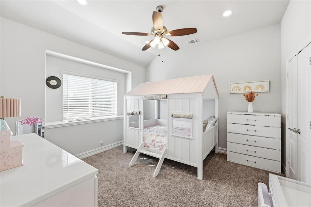 609 Dusty Glen Trail Midlothian, TX 76065 - Photo 23 of 40 a bedroom with a bed and a window