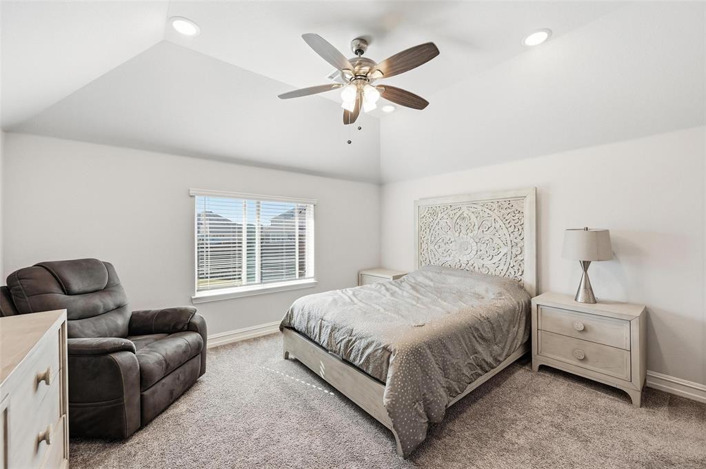 609 Dusty Glen Trail Midlothian, TX 76065 - Photo 24 of 40 a bedroom with bed couch and window