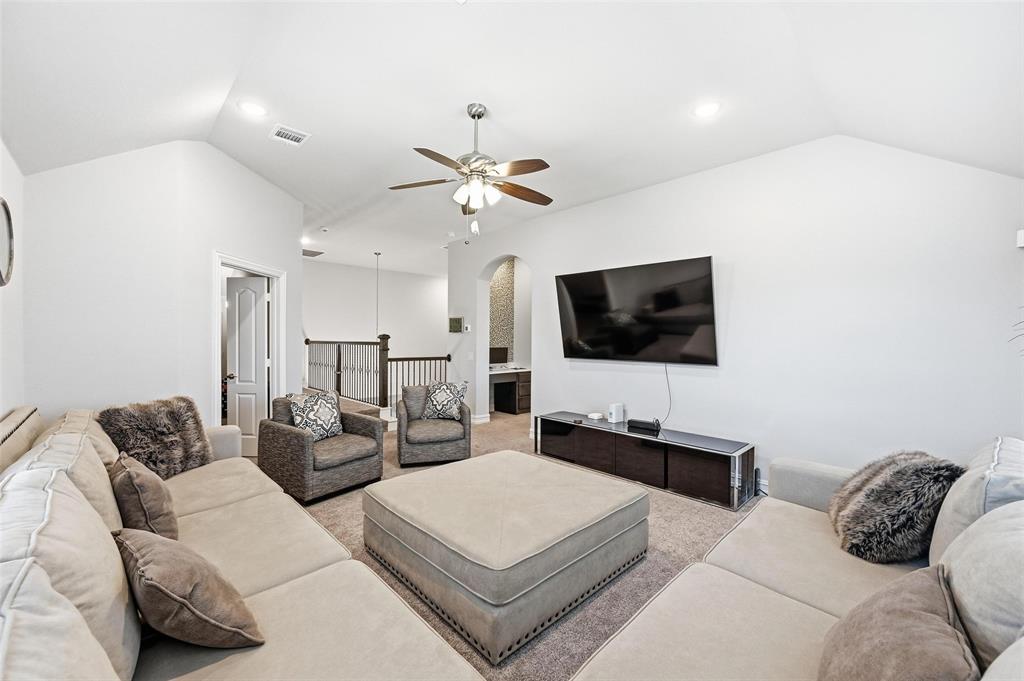 609 Dusty Glen Trail Midlothian, TX 76065 - Photo 28 of 40 a living room with furniture and a flat screen tv