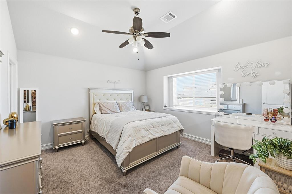 609 Dusty Glen Trail Midlothian, TX 76065 - Photo 30 of 40 a bedroom with a bed and a couch