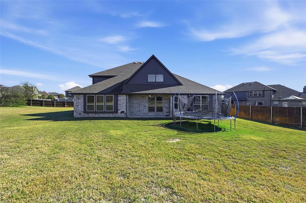 609 Dusty Glen Trail Midlothian, TX 76065 - Photo 34 of 40 a front view of house with yard and outdoor seating