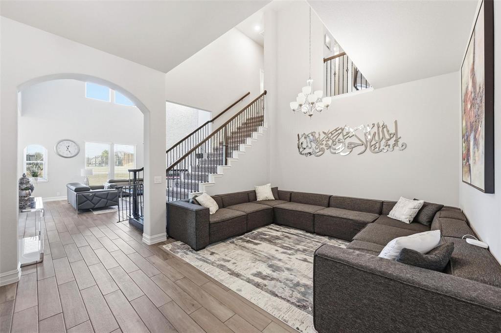 609 Dusty Glen Trail Midlothian, TX 76065 - Photo 4 of 40 a living room with furniture and wooden floor
