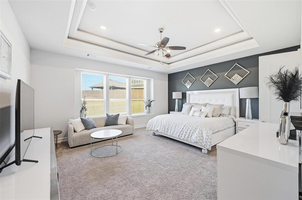 609 Dusty Glen Trail Midlothian, TX 76065 - Photo 5 of 40 a bedroom with a bed furniture and a flat screen tv