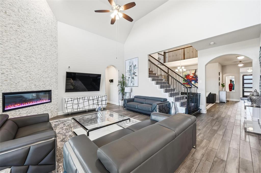 609 Dusty Glen Trail Midlothian, TX 76065 - Photo 7 of 40 a living room with furniture and a flat screen tv