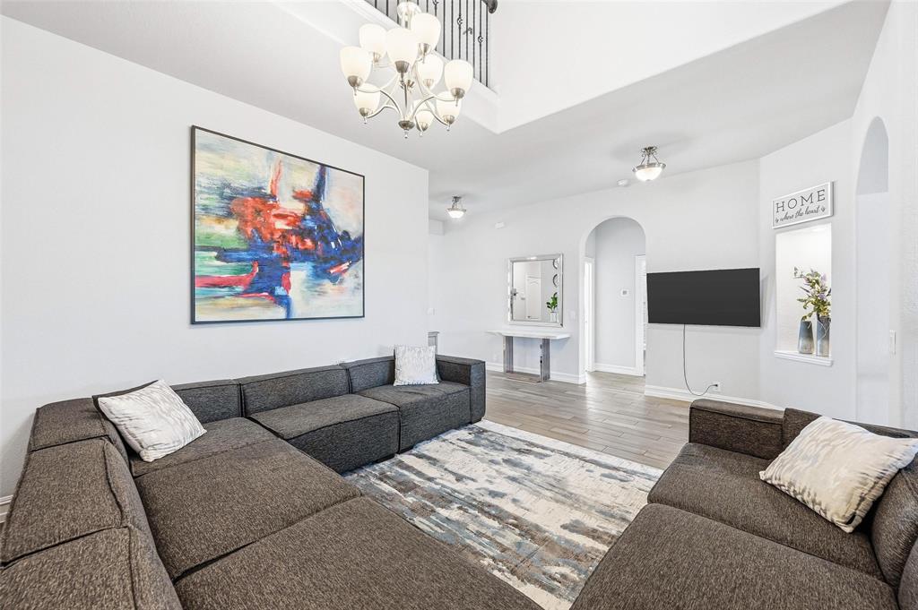 609 Dusty Glen Trail Midlothian, TX 76065 - Photo 8 of 40 a living room with furniture a desk and chair