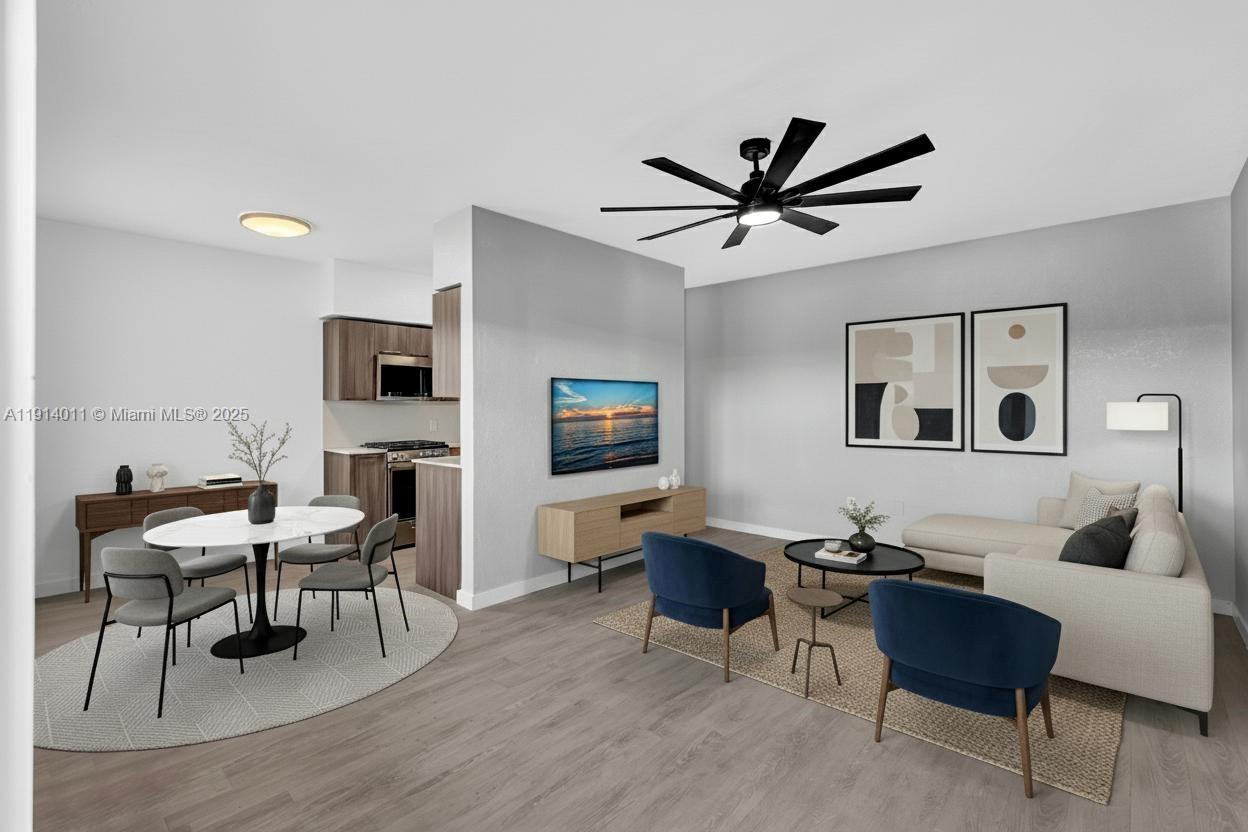 9200 East Bay Harbor Drive, Unit 2A Bay Harbor Islands, FL 33154 - Photo 1 of 45 a living room with furniture a rug and a flat screen tv