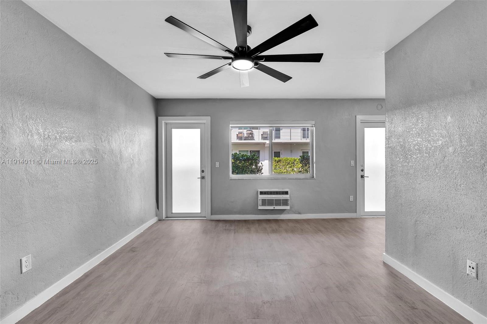9200 East Bay Harbor Drive, Unit 2A Bay Harbor Islands, FL 33154 - Photo 12 of 45 an empty room with cabinet and windows