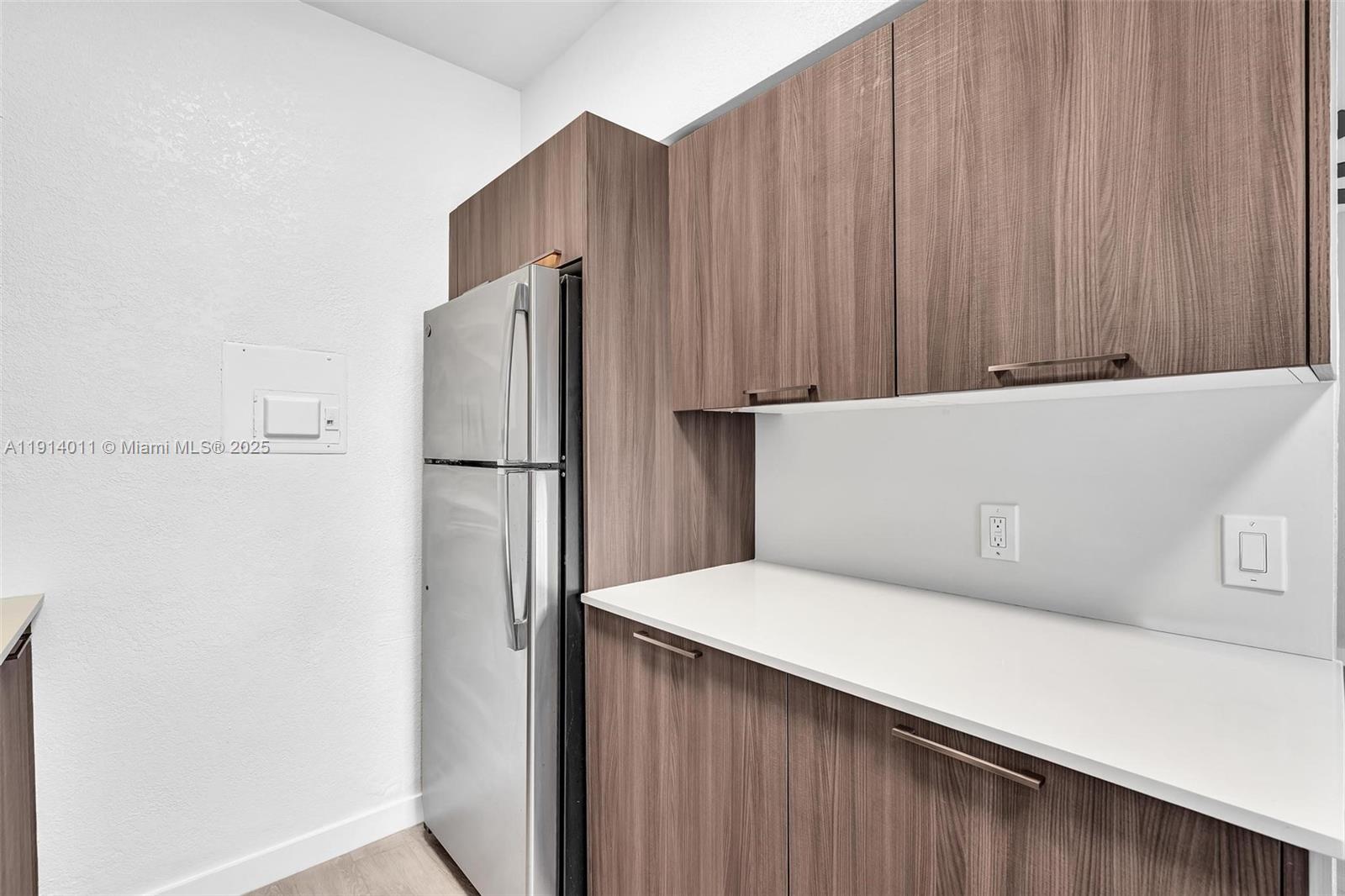 9200 East Bay Harbor Drive, Unit 2A Bay Harbor Islands, FL 33154 - Photo 18 of 45 a kitchen with a refrigerator freezer and a dishwasher