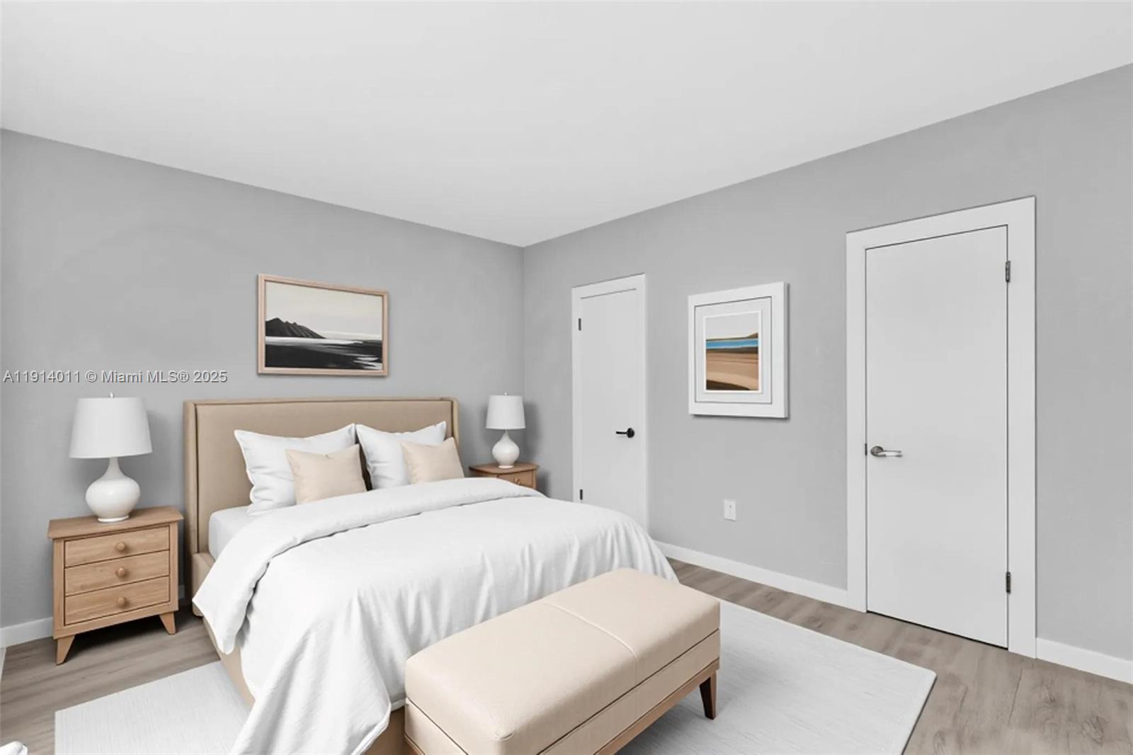 9200 East Bay Harbor Drive, Unit 2A Bay Harbor Islands, FL 33154 - Photo 2 of 45 a bedroom with a bed and a night stand