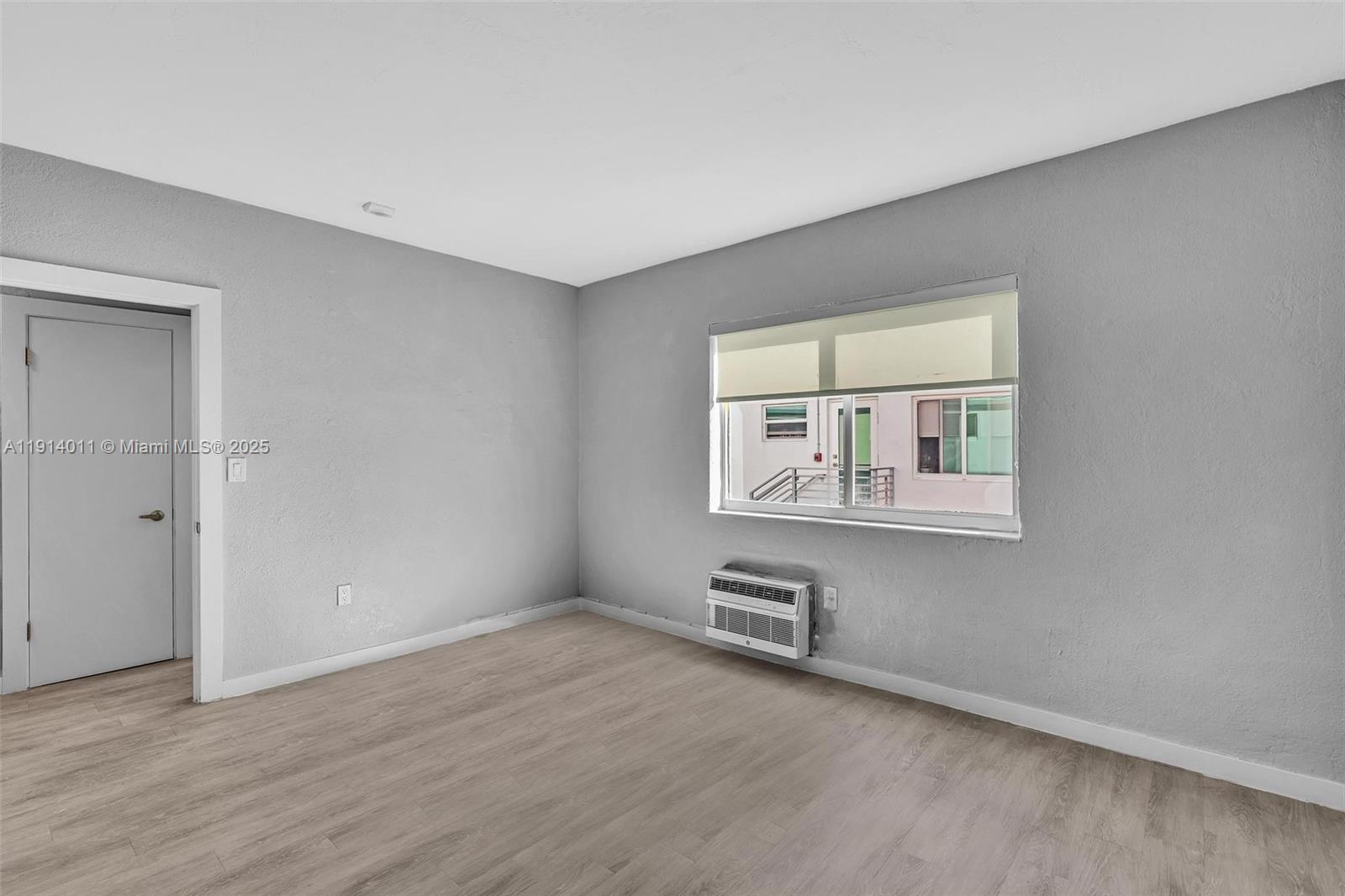 9200 East Bay Harbor Drive, Unit 2A Bay Harbor Islands, FL 33154 - Photo 23 of 45 an empty room with windows