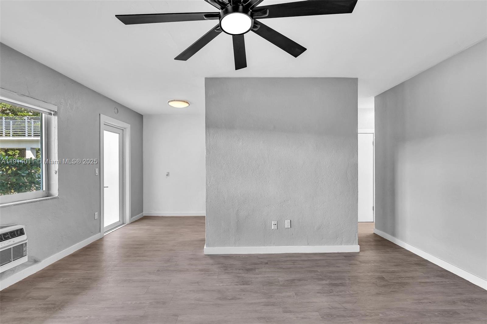 9200 East Bay Harbor Drive, Unit 2A Bay Harbor Islands, FL 33154 - Photo 27 of 45 an empty room with windows and fan