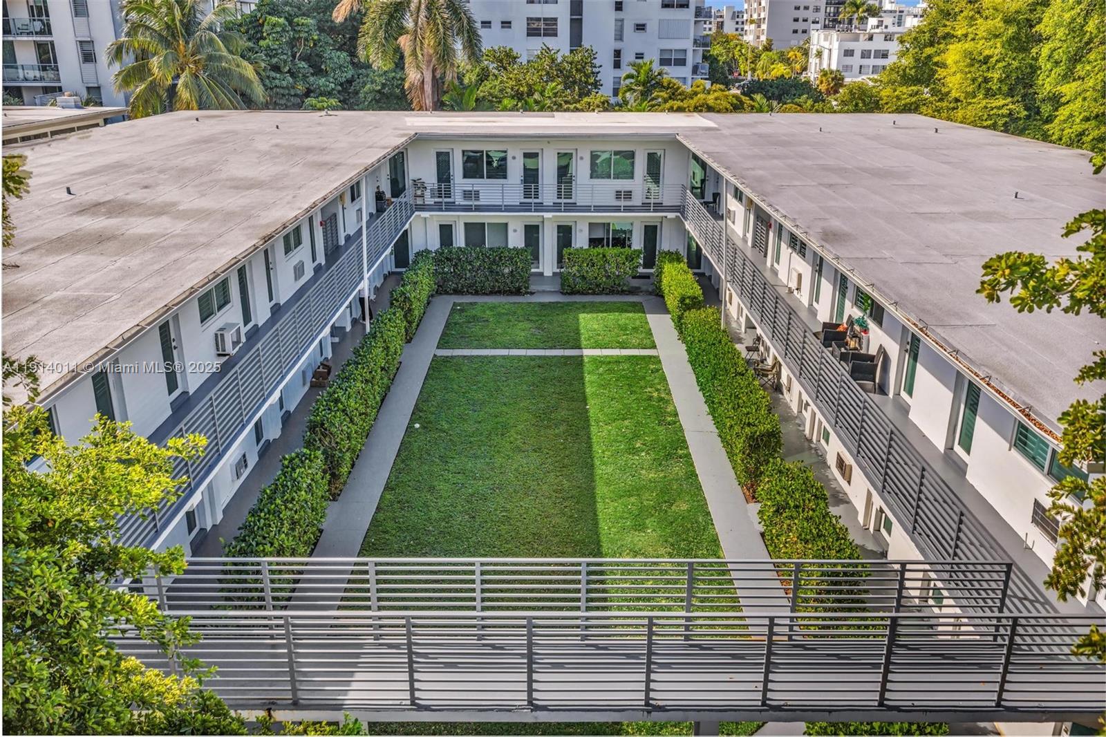 9200 East Bay Harbor Drive, Unit 2A Bay Harbor Islands, FL 33154 - Photo 34 of 45 a balcony with yard and outdoor seating