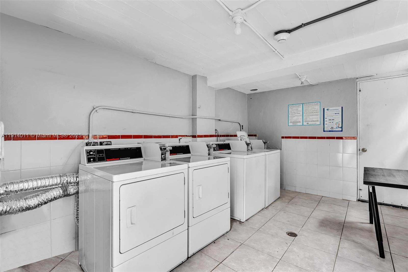 9200 East Bay Harbor Drive, Unit 2A Bay Harbor Islands, FL 33154 - Photo 38 of 45 a utility room with dryer and washer